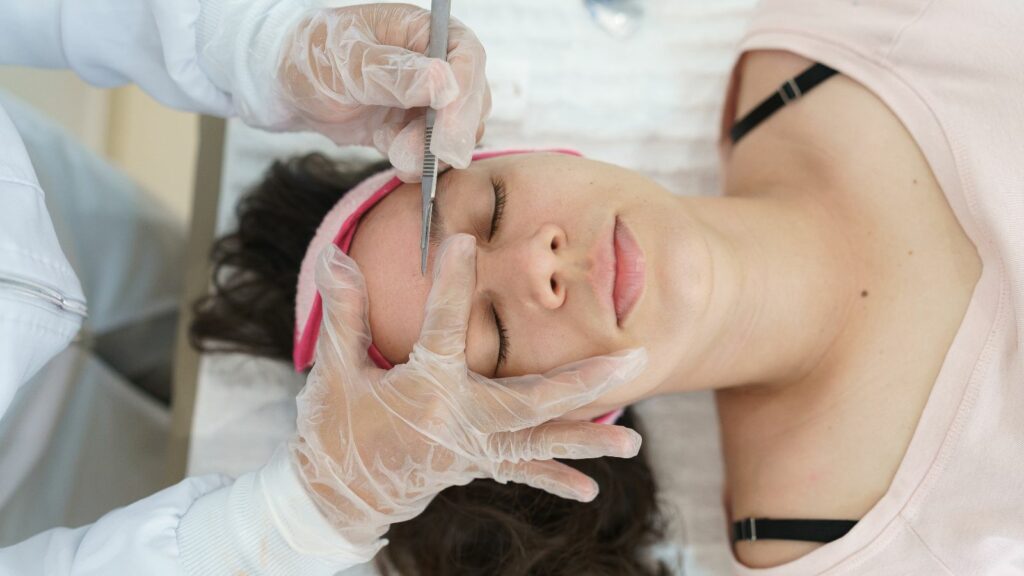 Woman in session with a Professional in Dermaplaning