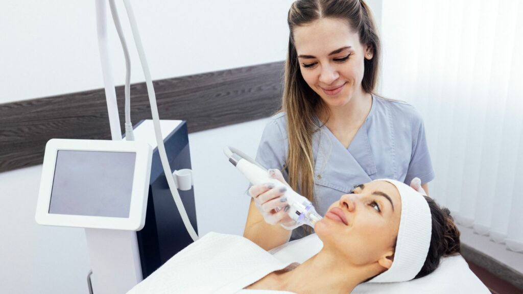 A happy professional while micro needling its patient.