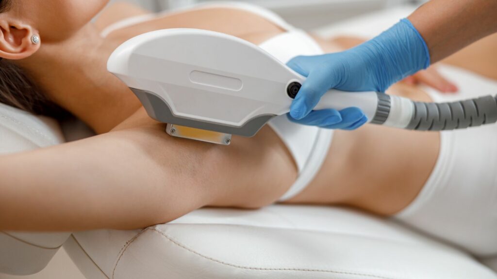Woman in session of hair removal on her underarm.