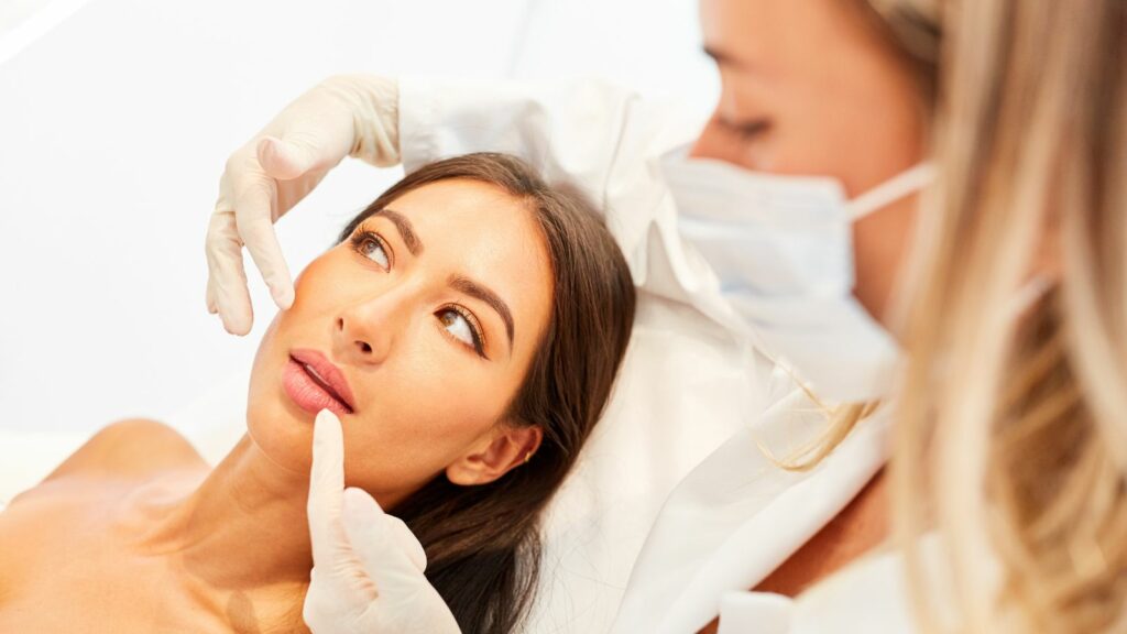 Patient and doctor giving advice about a facelift or skin treatment.